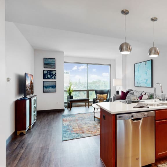Thumbnail 2 of 14 Midtown Crossing Apartments has floor-to-ceiling windows that fill this 1 bedroom apartment with bright natural light.