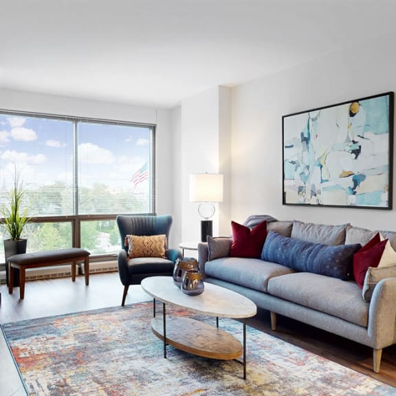 Thumbnail 5 of 14 Enjoy the scenic views from the floor-to-ceiling windows in the living area of a 1 bedroom floor plan at Midtown Crossing Apartments Omaha