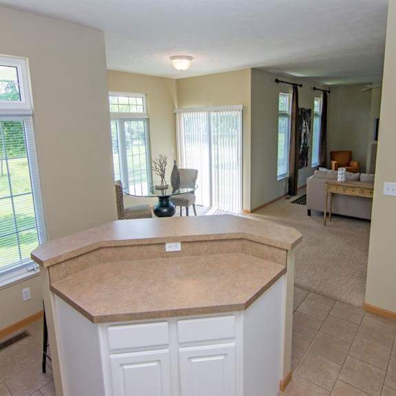 Thumbnail 4 of 13 View from Kitchen of Dining Room and Living Room at Cascade Pines Duplex Homes in Lincoln NE