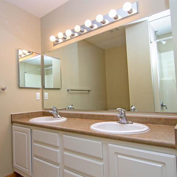 Thumbnail 12 of 13 Master Bathroom with dual sinks and white cabinetry at Cascade Pines Duplex Homes in Lincoln NE