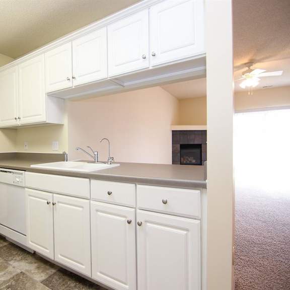 Thumbnail 4 of 12 Galley Style Kitchen with white upper and lower cabinets