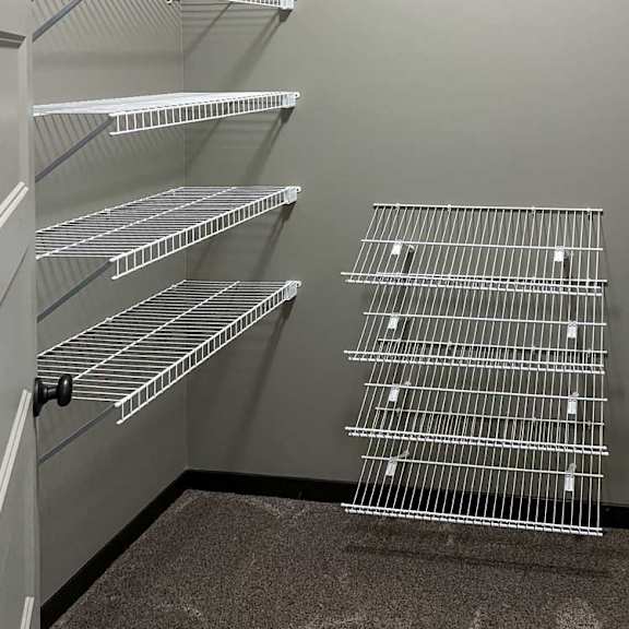 Thumbnail 14 of 20 a walk-in closet with built-in shelving and hanging space