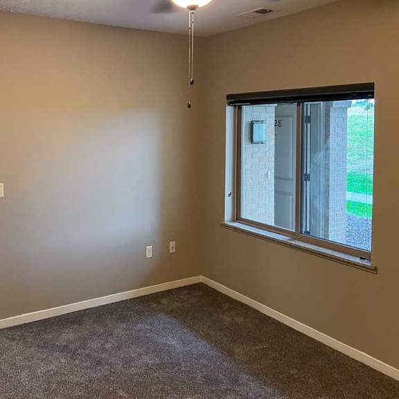 Thumbnail 12 of 35 a bedroom with carpeted flooring, a window, and a ceiling fan