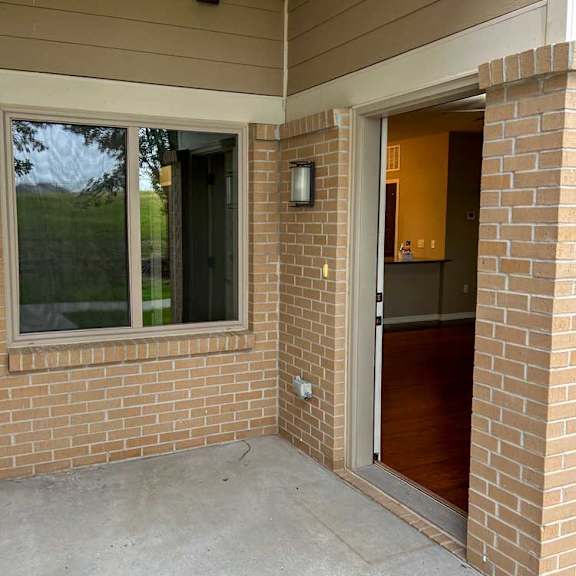 Thumbnail 2 of 35 the front door patio space with a large window to the bedroom