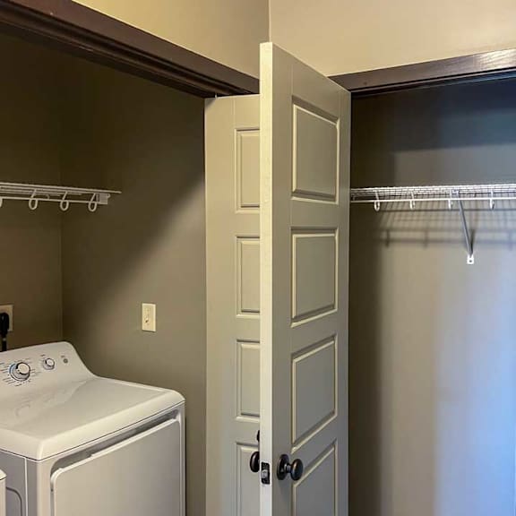 Thumbnail 27 of 35 a laundry room next to hall closet