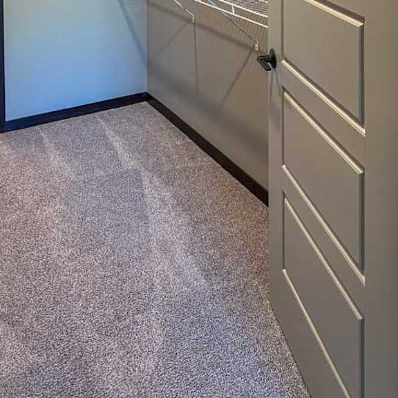 Thumbnail 16 of 19 a walk-in closet with built in shelving and hanging space
