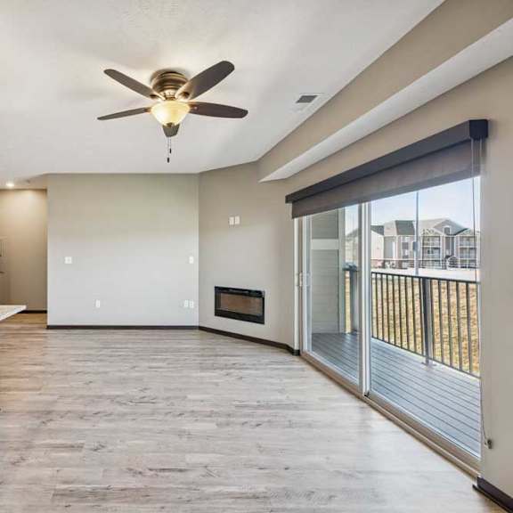 Thumbnail 20 of 37 A spacious kitchen with a granite countertop and a ceiling fan.