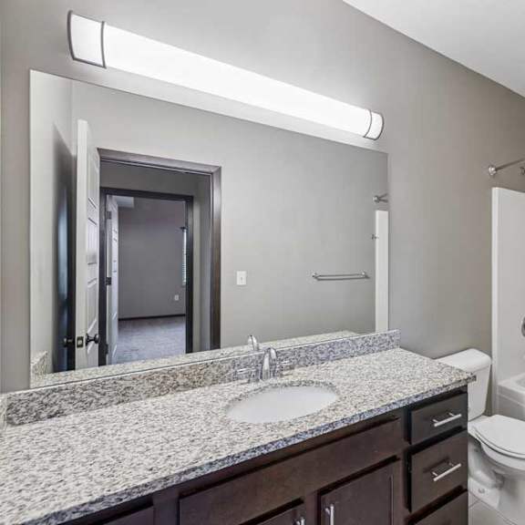 Thumbnail 33 of 33 A bathroom with a sink, toilet, and bathtub.