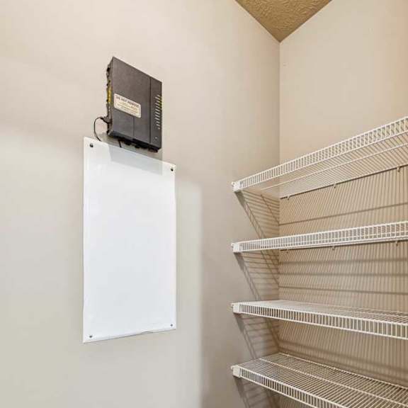 Thumbnail 25 of 25 A rack of white wire closet shelves