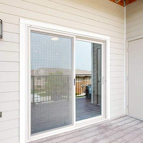 Thumbnail 15 of 51 A covered balcony with a screen door and an outdoor closet.