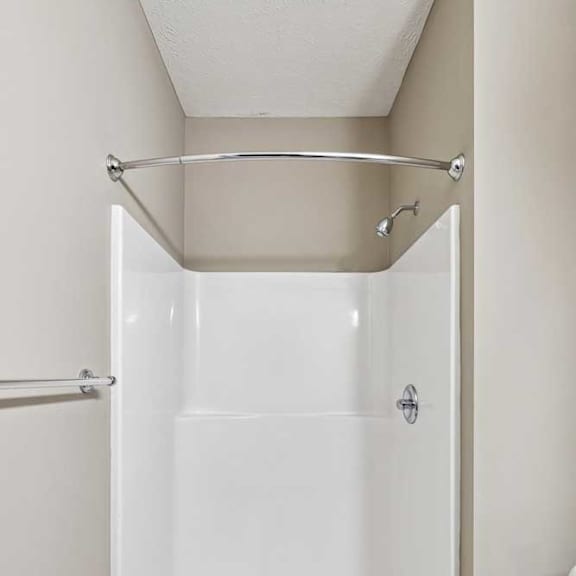 Thumbnail 17 of 25 Bathroom featuring a walk-in shower with white surround walls and a curved curtain rod.