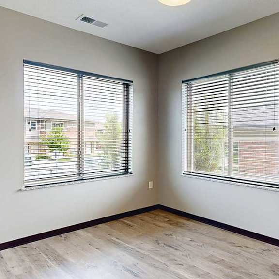Thumbnail 8 of 33 A dining area with two large window for plenty of natural light.