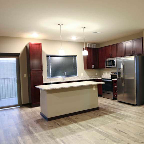 Thumbnail 3 of 43 Spacious kitchen with granite countertops in a 3 bedroom apartment for rent at North Pointe Villas best new apartments Lincoln NE 68521