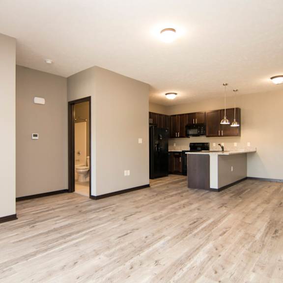 Thumbnail 8 of 14 A kitchen area with a counter and cabinets.