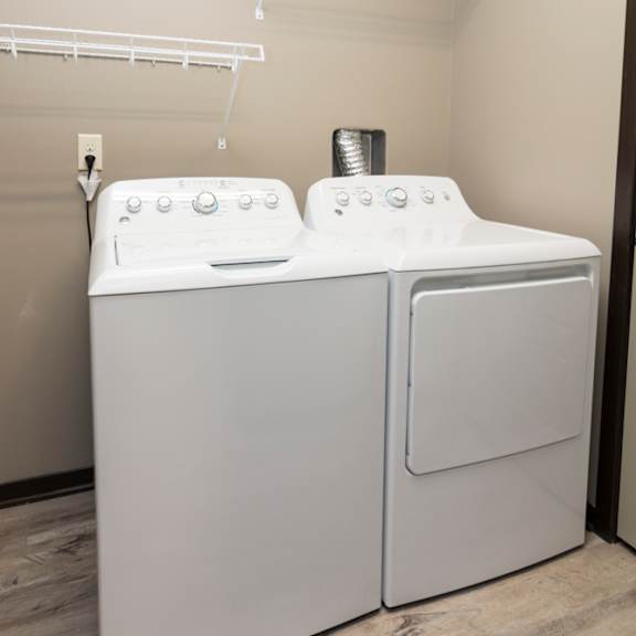 Thumbnail 5 of 14 White washer and dryer with wire shelving above them