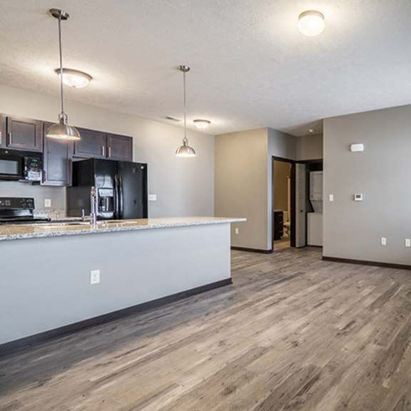 Thumbnail 5 of 9 Large open concept floor plan with hardwood-style flooring at North Pointe Villas