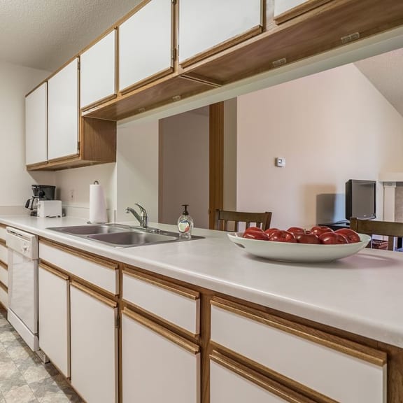 Thumbnail 2 of 14 a kitchen with white cabinets and a sink      and a door
