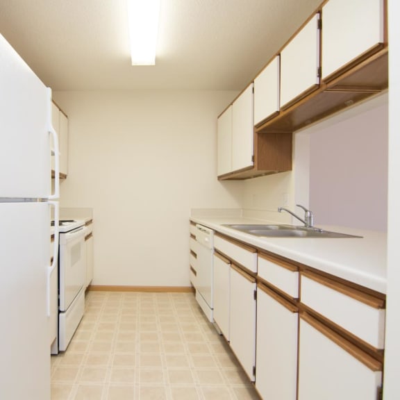 Thumbnail 3 of 15 a kitchen with white cabinets and a white refrigerator