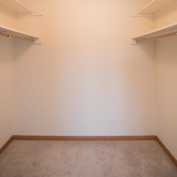 Thumbnail 14 of 15 a empty room with shelves on the wall