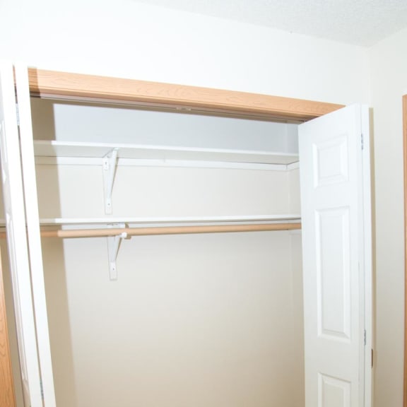 Thumbnail 19 of 21 an empty closet in a room with a white door
