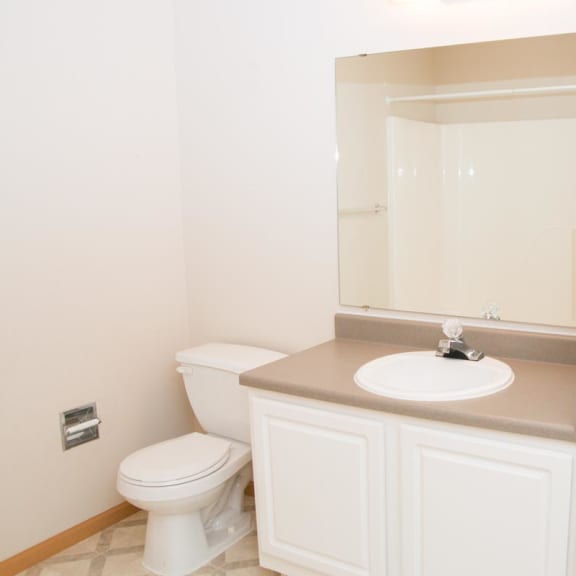 Thumbnail 12 of 21 a bathroom with a toilet and a sink