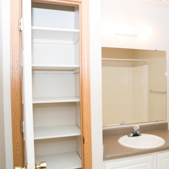 Thumbnail 15 of 21 a bathroom with a sink and a mirror and a toilet