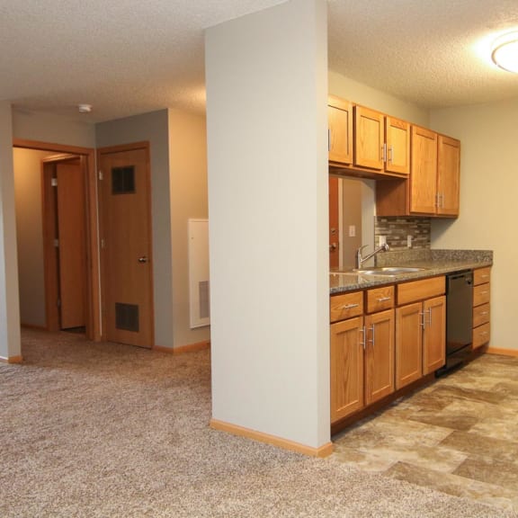 Thumbnail 2 of 27 a kitchen with a sink and a refrigerator