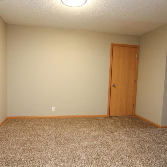Thumbnail 11 of 27 an empty room with a door and a tiled floor