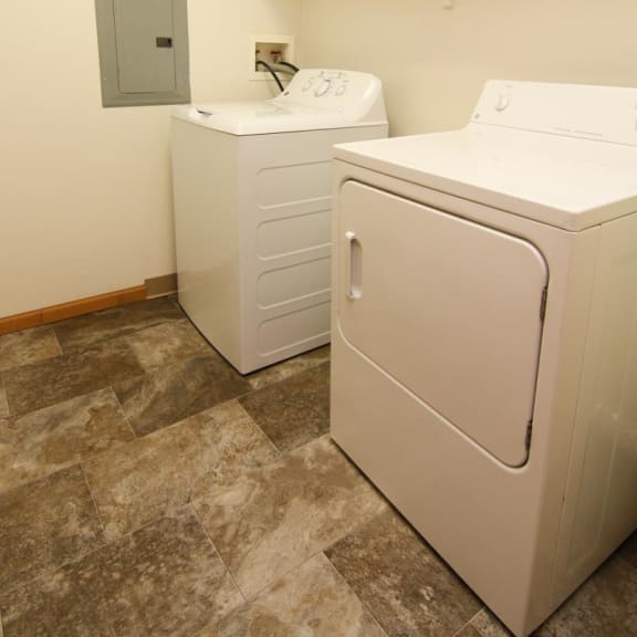 Thumbnail 10 of 27 a laundry room with a washer and a dryer in it