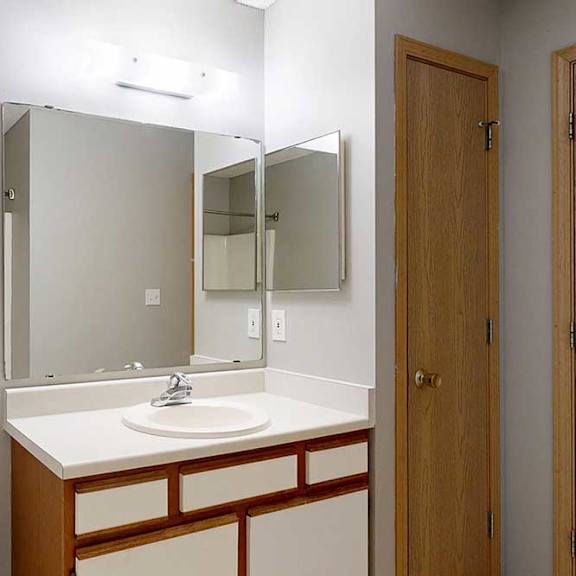 Thumbnail 26 of 29 A bathroom with a white sink and white cabinet