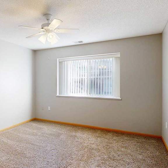 Thumbnail 13 of 29 bedroom with a ceiling fan and a window with blinds.