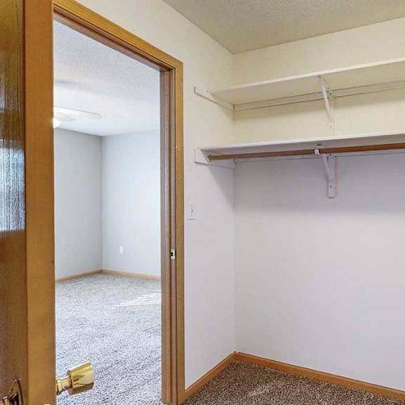 Thumbnail 11 of 29 large walk-in closet with a shelving