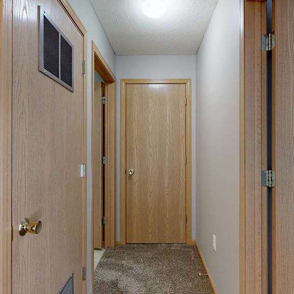 Thumbnail 23 of 29 a hallway with a doors
