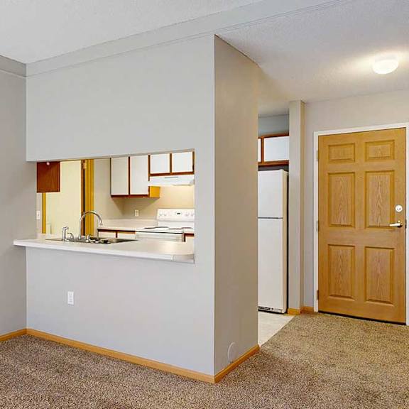 Thumbnail 20 of 29 galley style kitchen area with a counter with room for seating