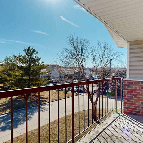 Thumbnail 26 of 27 balcony view overlooking trees and yard