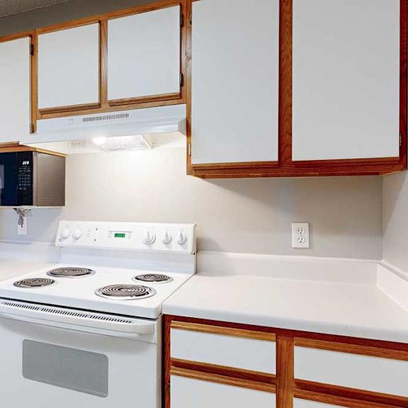 Thumbnail 22 of 27 kitchen with white stove with a microwave and refridgerator