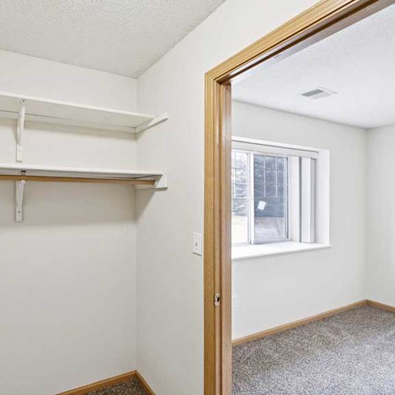 Thumbnail 53 of 56 Empty room with a window and a door.