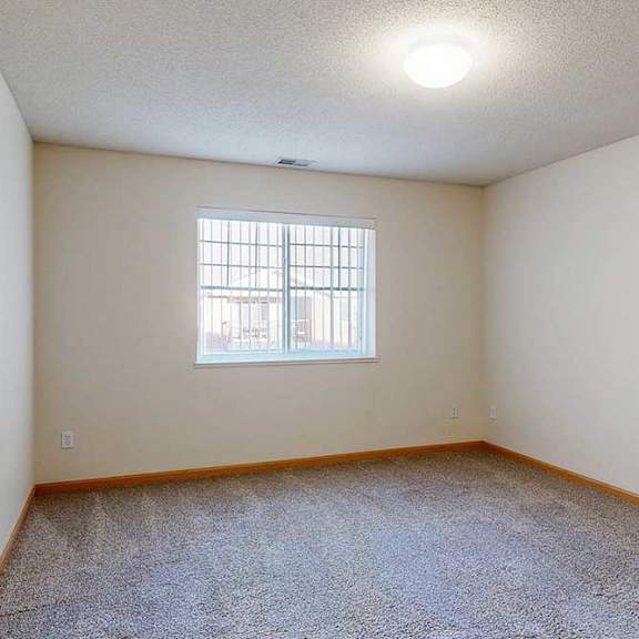 Thumbnail 21 of 28 bedroom with a window and a carpeted floor
