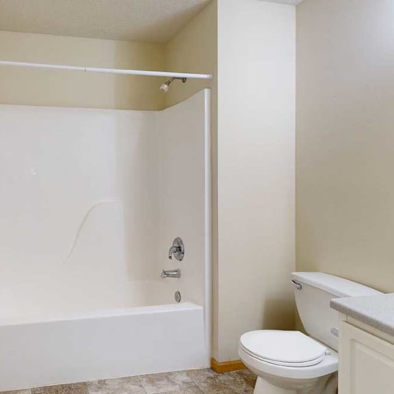 Thumbnail 26 of 28 bathroom with bathtub/shower combo and toilet.