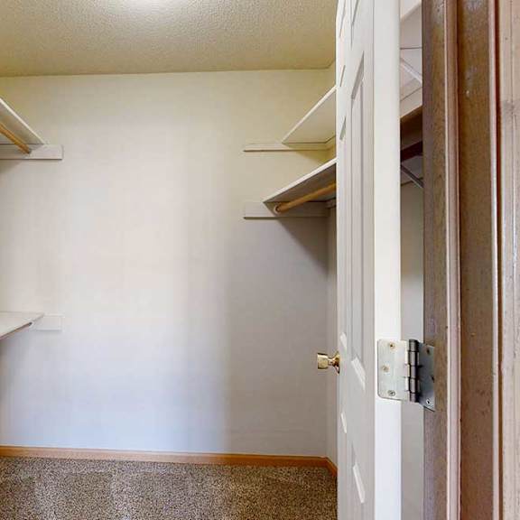 Thumbnail 13 of 28 large walk-in closets with a shelving and storage