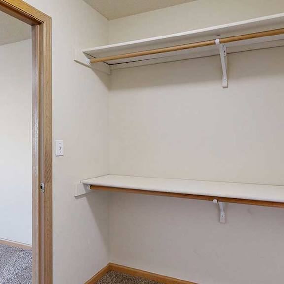 Thumbnail 12 of 28 large walk-in closets with a shelving and storage