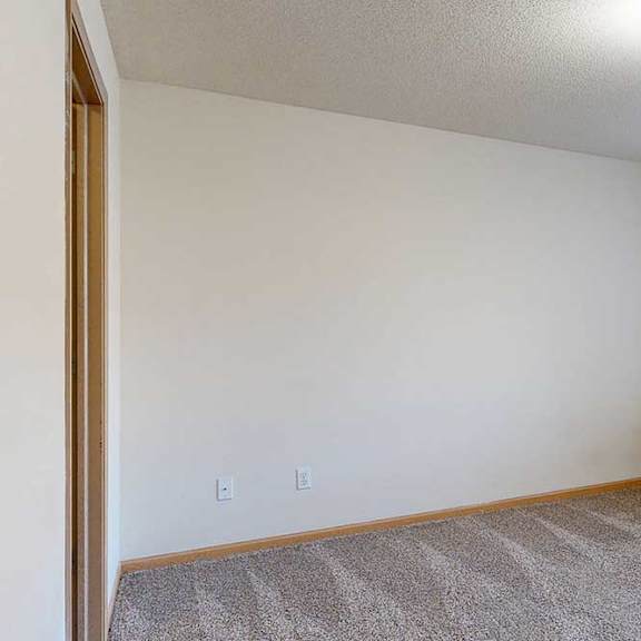 Thumbnail 24 of 28 bedroom with a carpeted floor and a window with blinds.