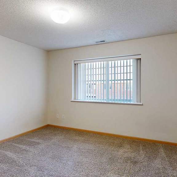 Thumbnail 22 of 28 bedroom with a window and carpeted floor