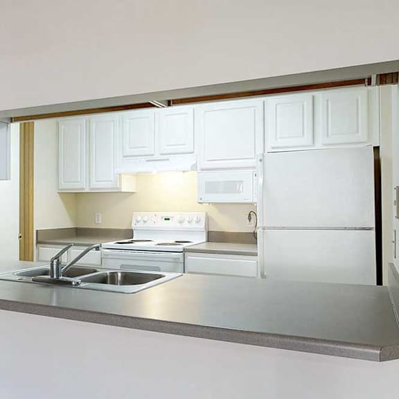 Thumbnail 4 of 28 a kitchen with white cabinets and a breakfast bar with seating
