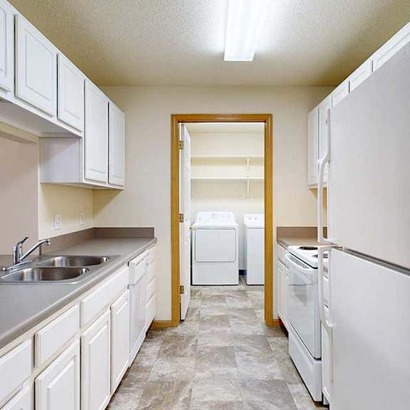 Thumbnail 20 of 28 galley kitchen with white appliances and cabinets