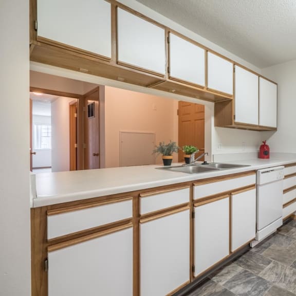 Thumbnail 5 of 17 a kitchen with white cabinets and a sink