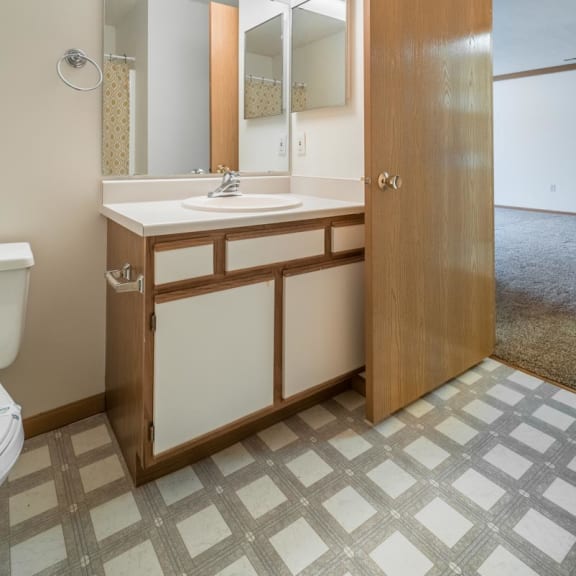 Thumbnail 16 of 17 a bathroom with a sink and a mirror