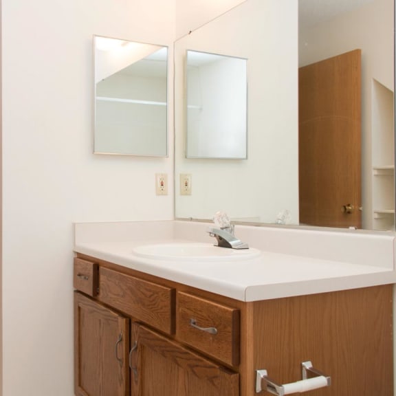 Thumbnail 8 of 16 a bathroom with a sink and a mirror