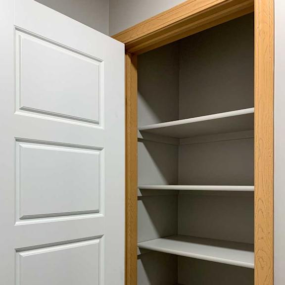 Thumbnail 20 of 21 a linen closet with built-in shelves