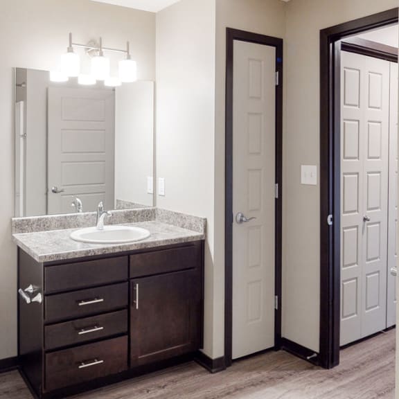 Thumbnail 9 of 10 Renovated bathroom with linen storage closet at Northridge Heights Apartments